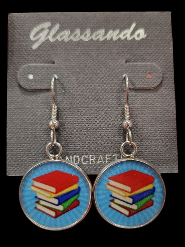 book earrings on black background
