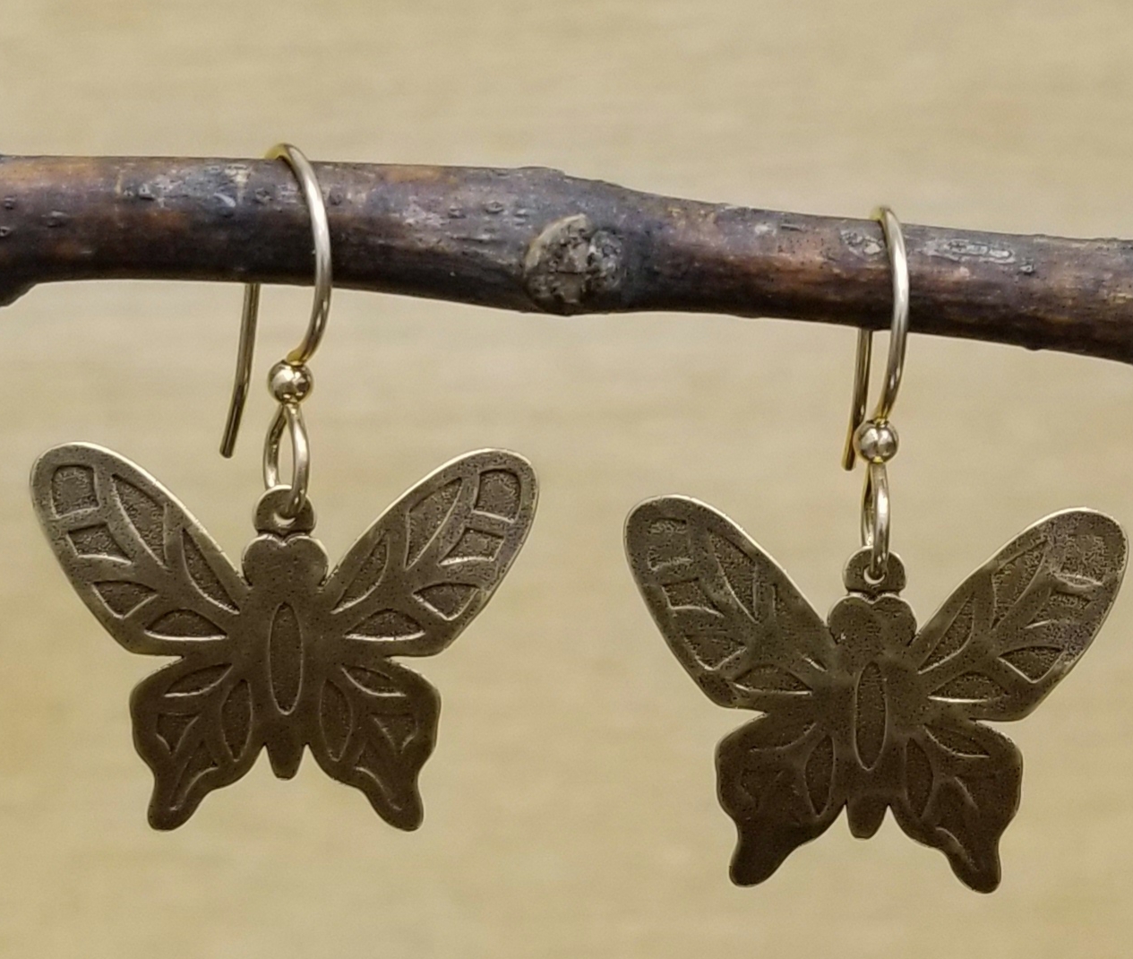 antiqued brass butterfly earrings by Joseph Brinton