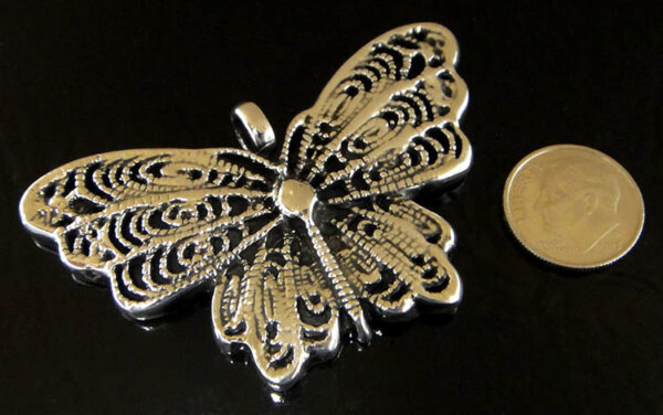 Handmade .925 sterling silver detailed butterfly pendant shown with dime (not included) for scale