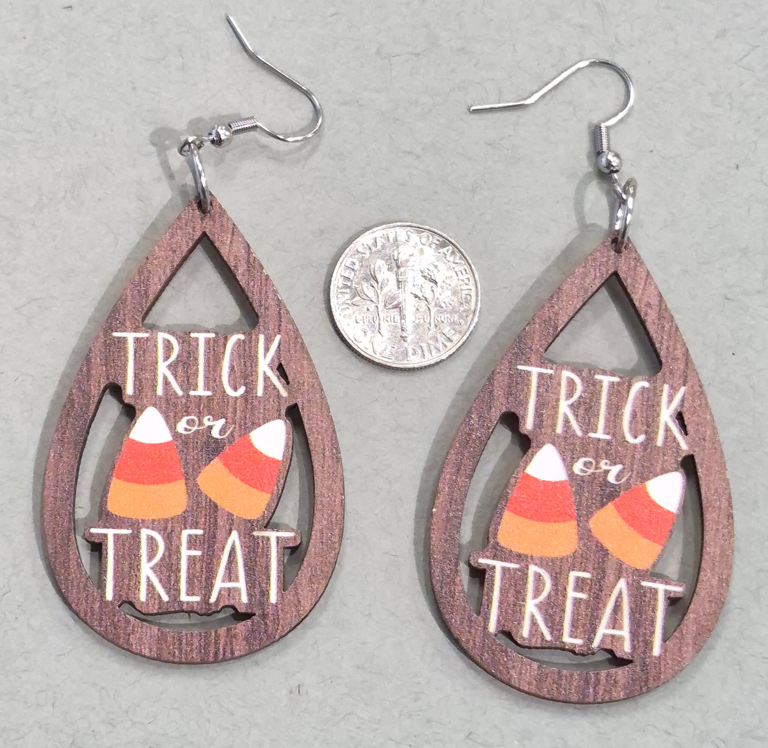 wood candy corn earrings with dime for size comparison