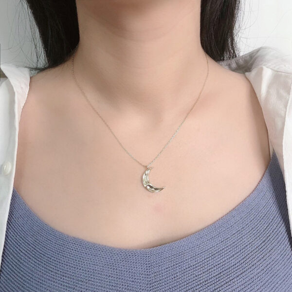 sterling silver cresent moon necklace on model