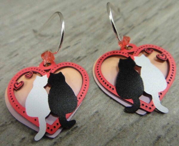 black and white cat earrings in heart