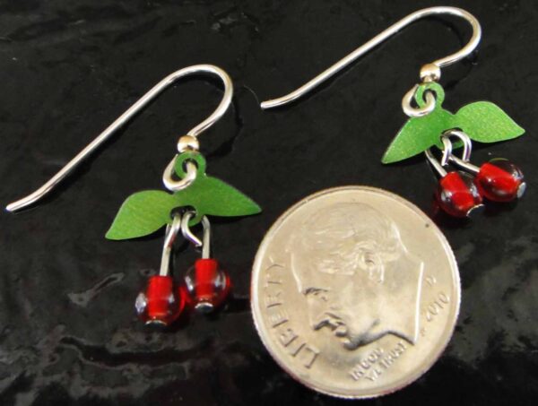 backside of cherry earrings with dime for scale