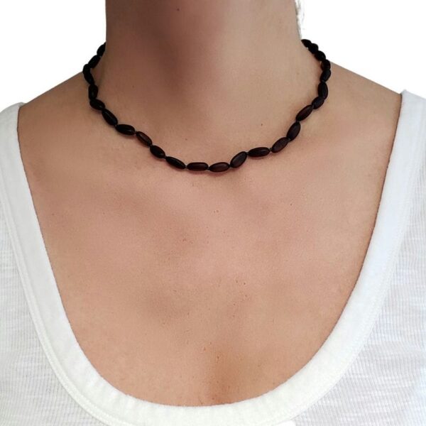 cherry amber beaded necklace on model