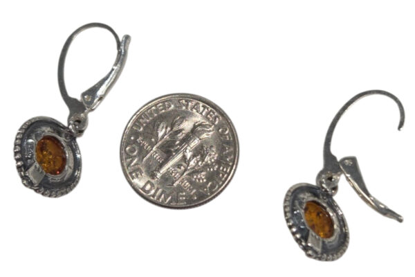 backside of amber circle earrings with dime for size comparison