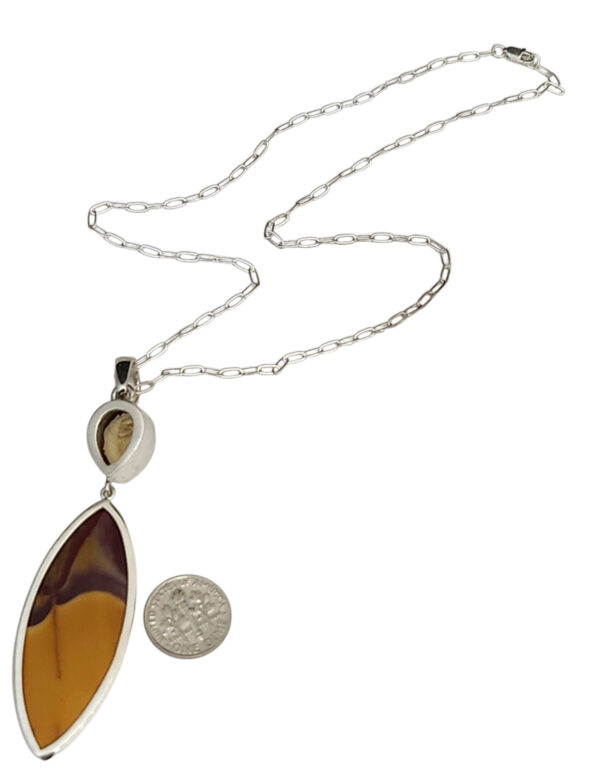 backside of citrine and mookaite jasper necklace with dime for size comparison
