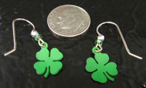 back of four leaf clover earrings with dime to help gauge scale