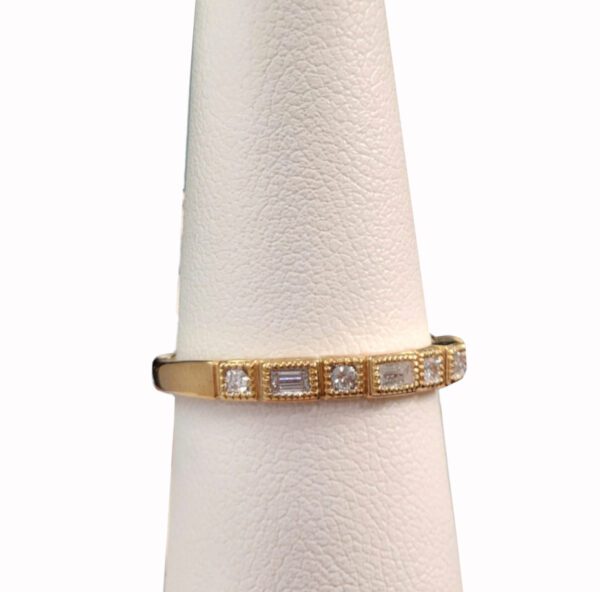 side view of diamond and gold ring