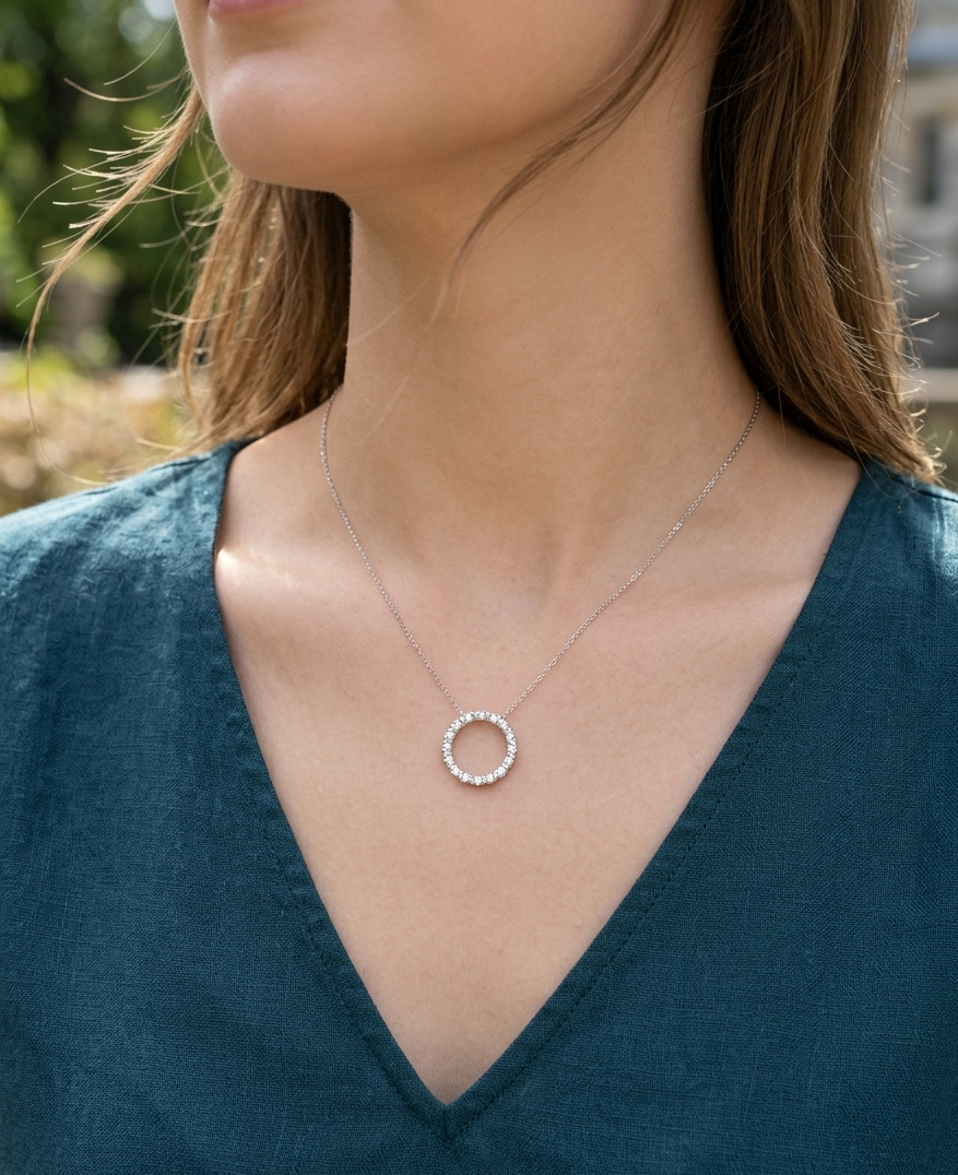 white gold and diamond circle necklace on woman
