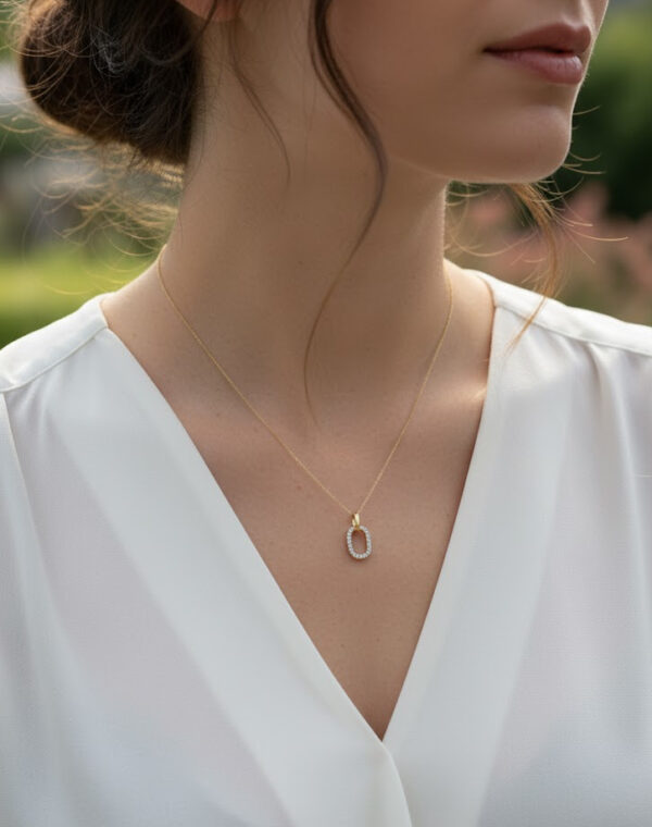 dainty diamond oval necklace on model
