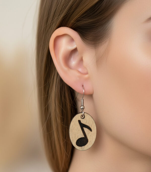 music note earrings on model