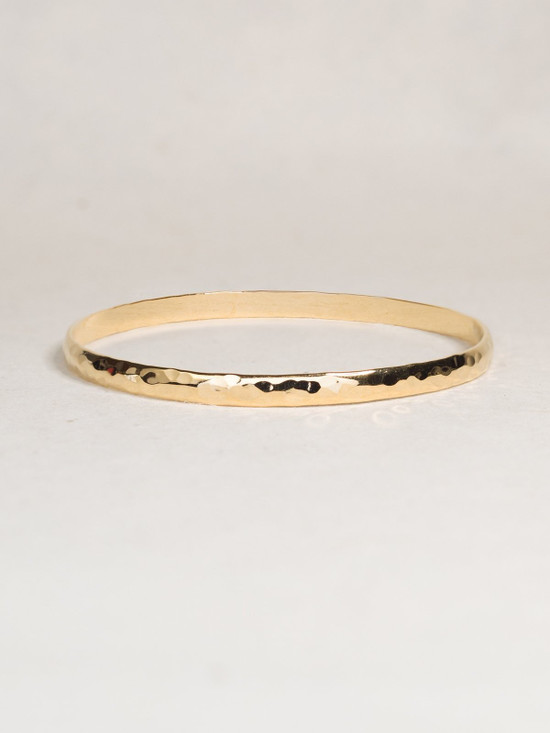 hammered goldtone bangle bracelet by Holly Yashi