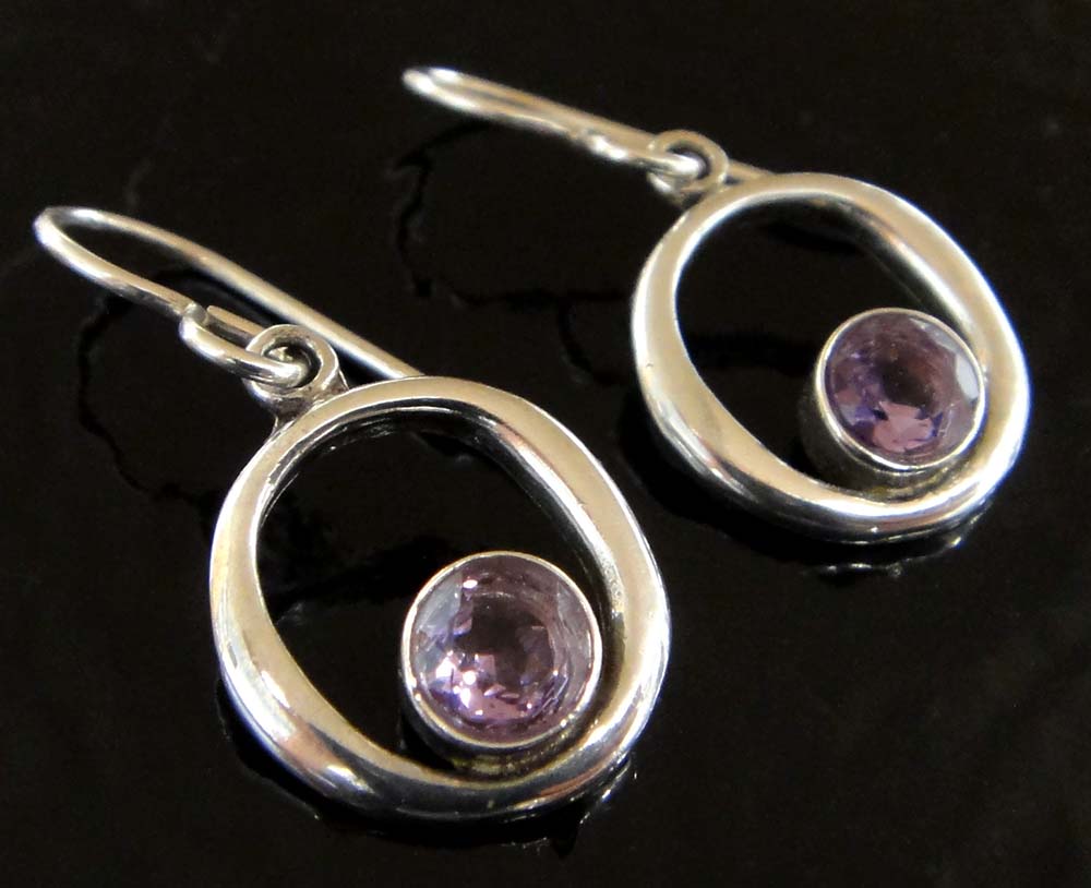 These amethyst and sterling silver earrings are handmade by Sonoma Art Works.