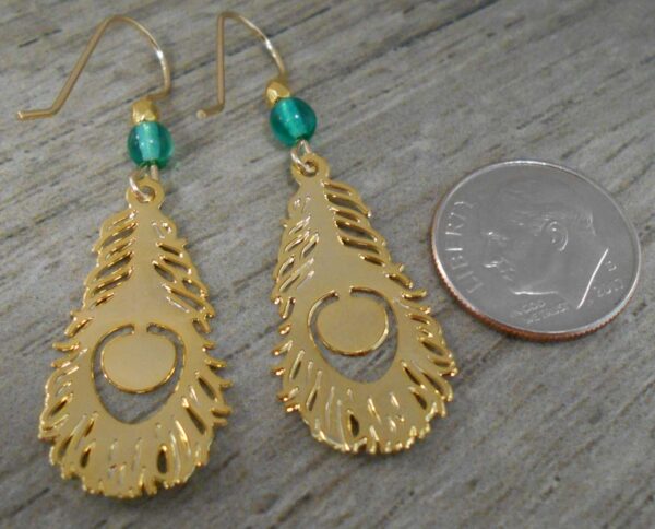 Back of gold and green colored peacock feather earrings handmade by Sienna Sky