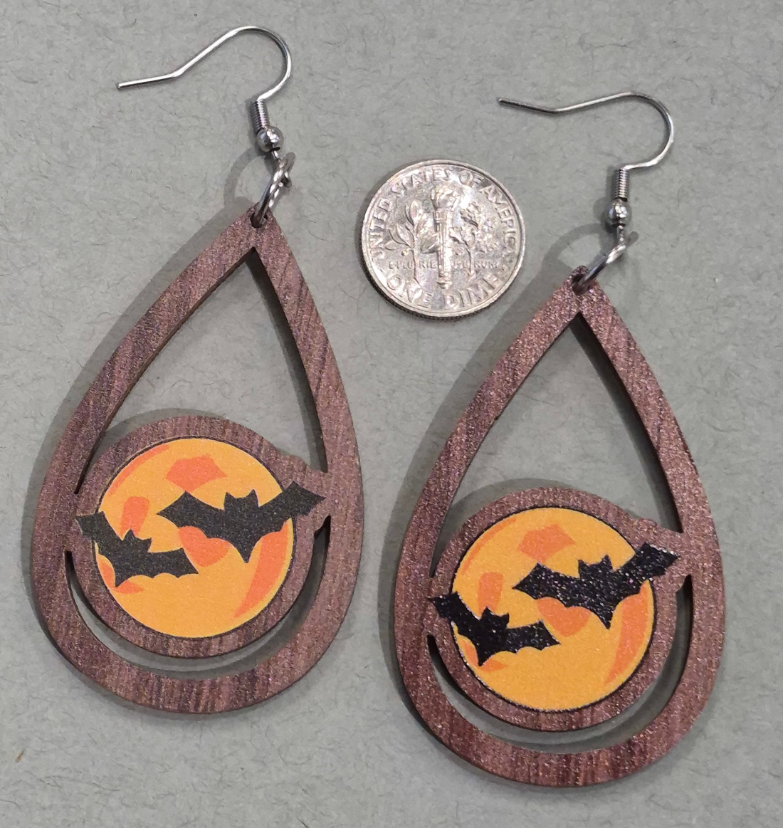 full moon and bat earrings with dime for size comparison