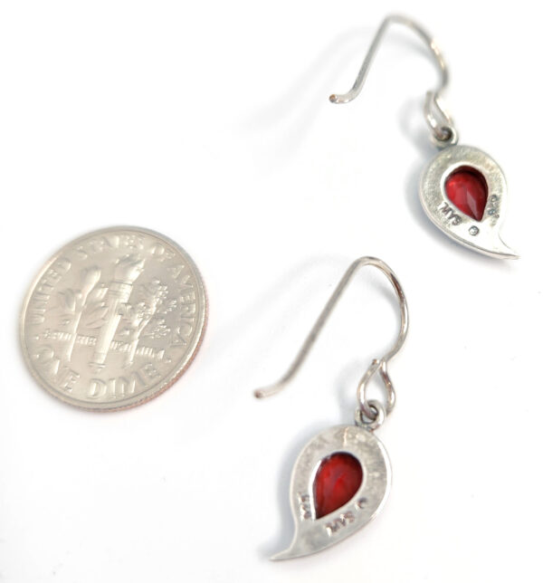 backside of garnet earrings with dime for size comparison