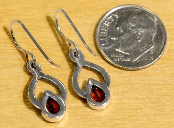 back of Sierra Designs red garnet and sterling silver drop earrings with dime