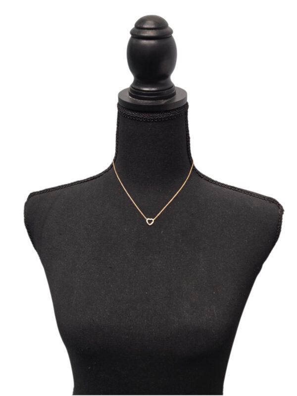 gold-plated sterling silver dainty heart necklace on dress form