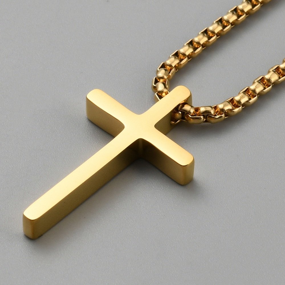 close up of gold-plated stainless steel cross necklace