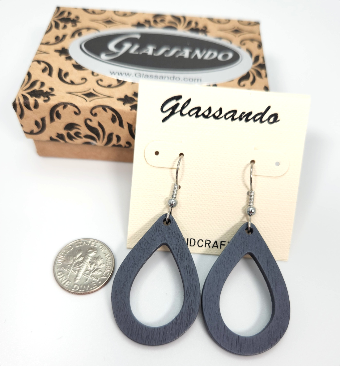 Gray wooden drop earrings with dime for size comparison