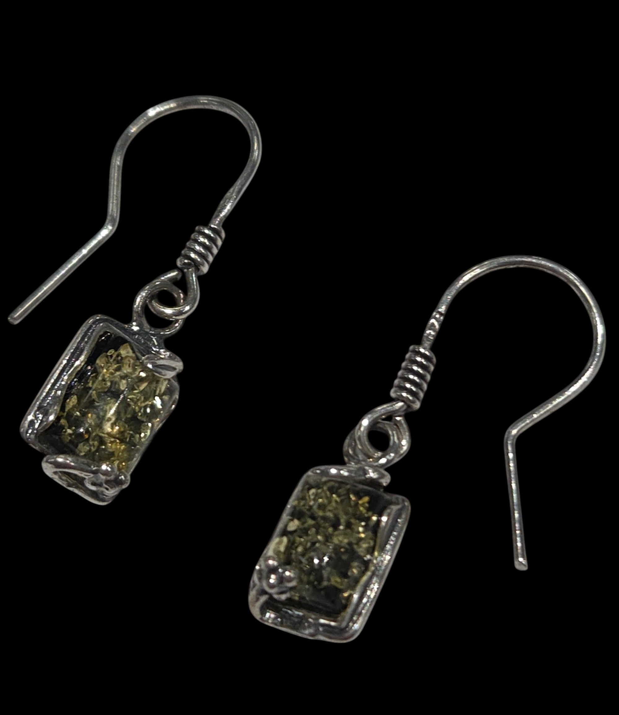 green Baltic amber and sterling silver earrings on black background