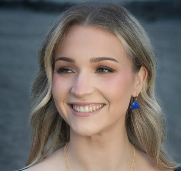 blue fan shape earrings on model