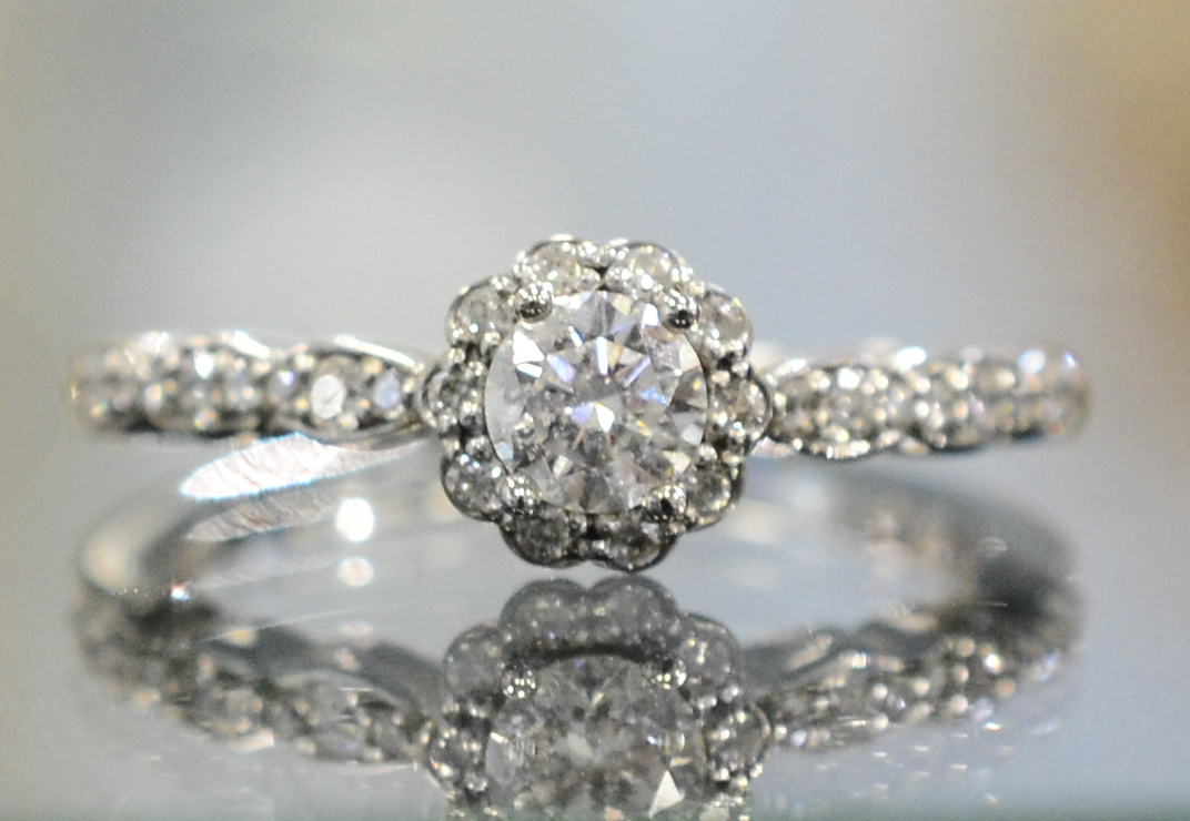 diamond and 14K white gold halo style engagement ring