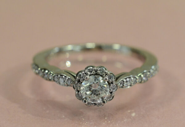 Diamond and 14K white gold halo style engagement ring