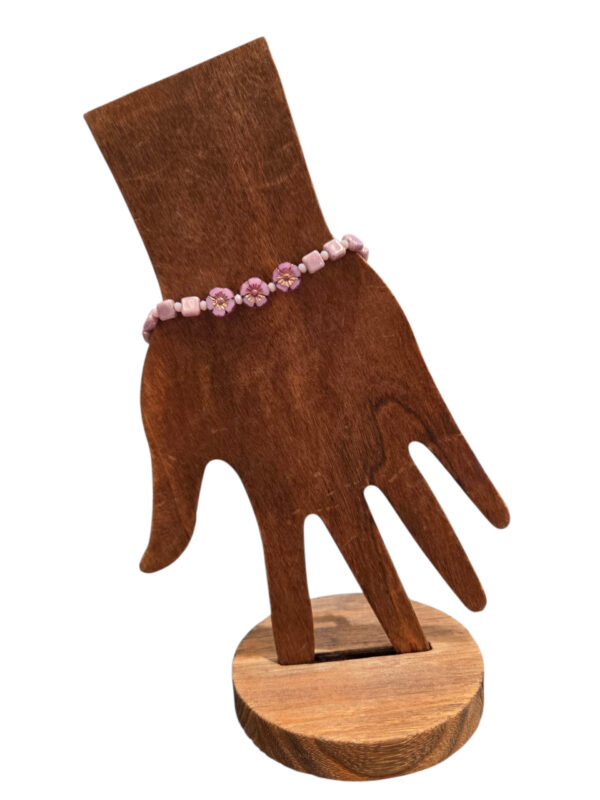 bracelet on wooden hand form
