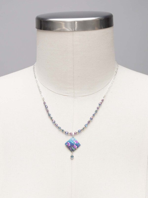 blue Holly Yashi necklace on dressform