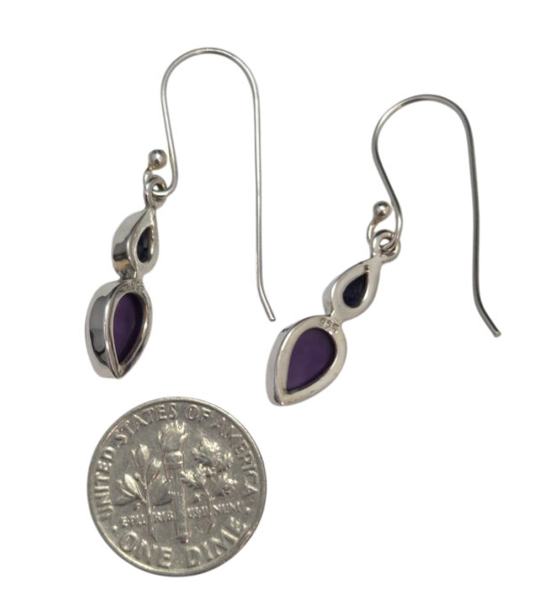 backside of iolite and amethyst earrings with dime for size comparison