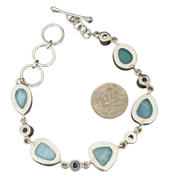 backside of larimar and blue topaz bracelet with dime for size comparison