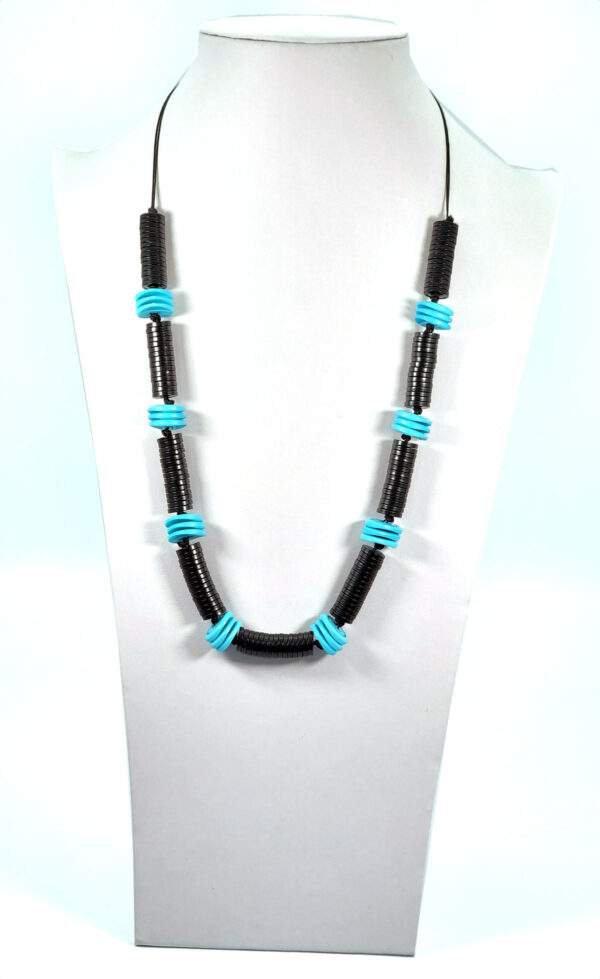 light blue and black repurposed button necklace on neckform