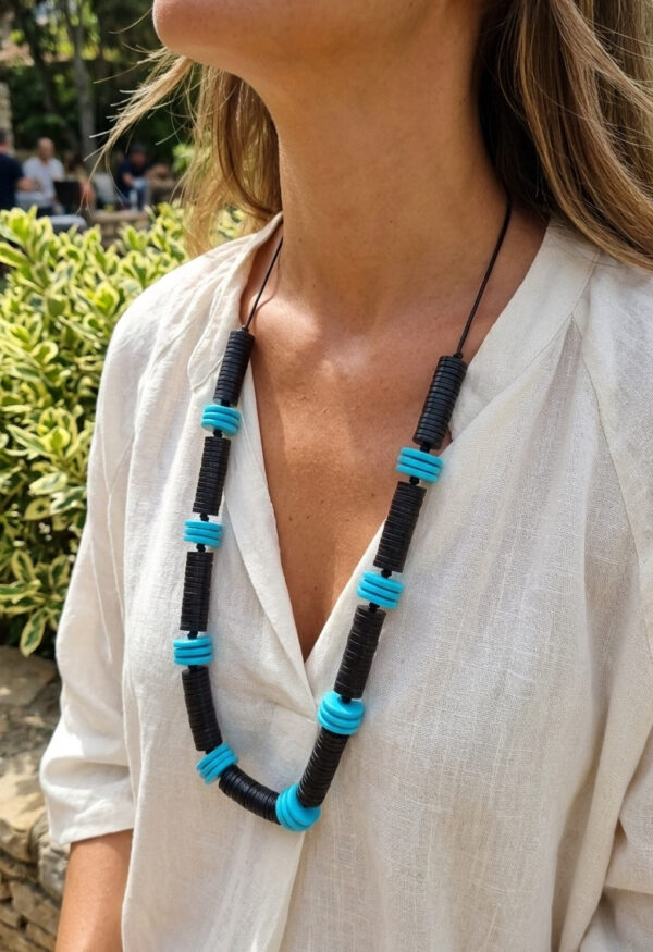black and blue recycled button necklace on woman