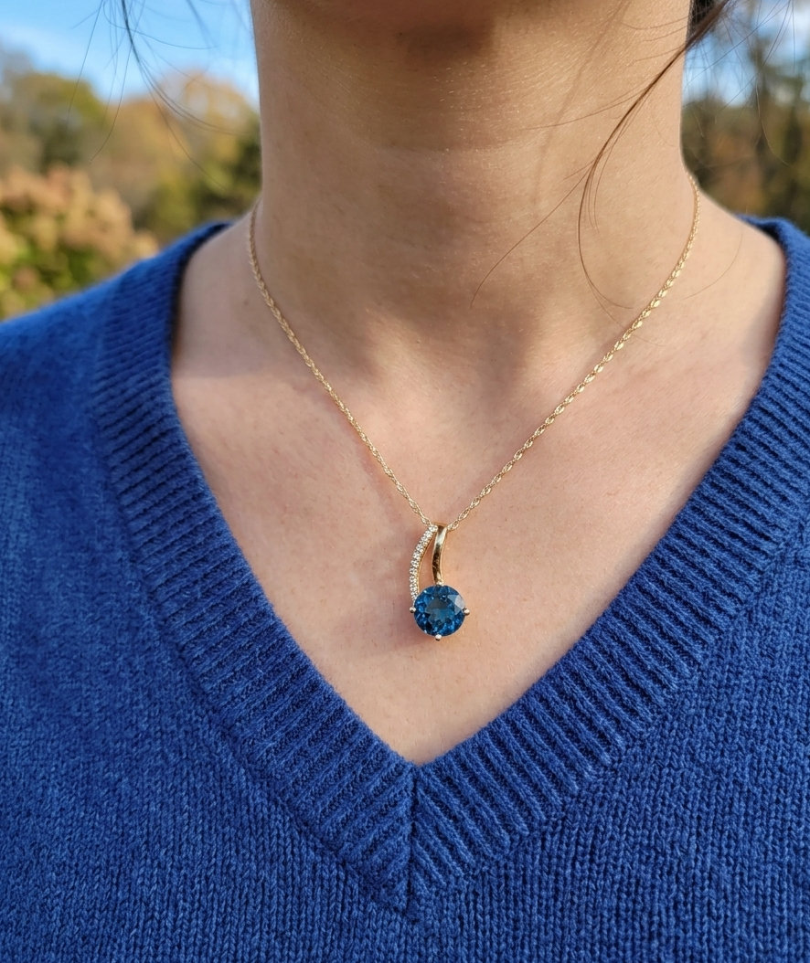 diamond and London blue topaz necklace on woman