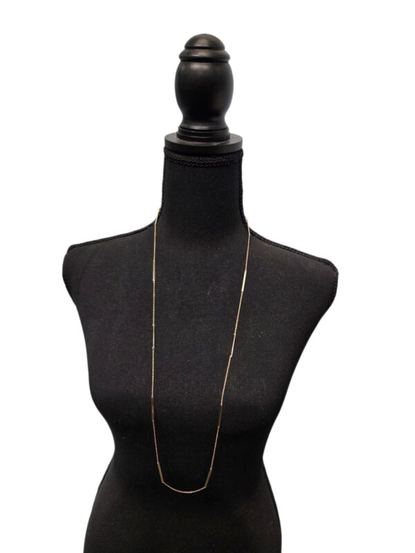 gold-plated sterling silver long bar and chain necklace on dressform