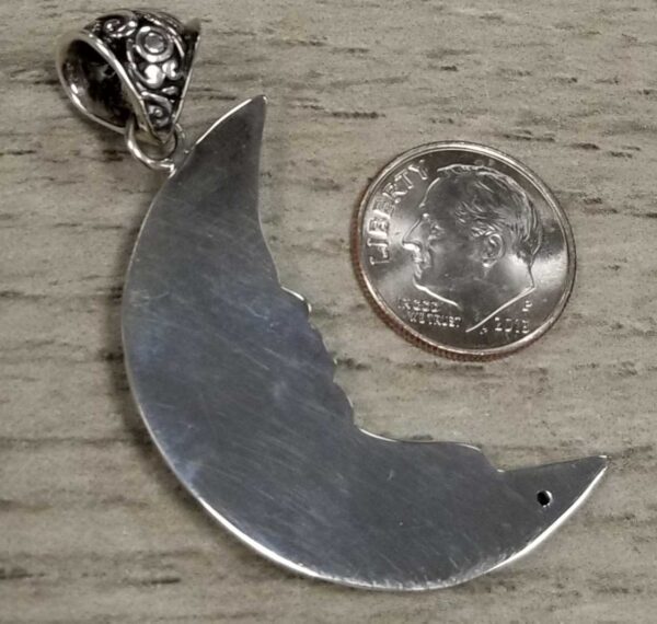 back of man in the moon pendant