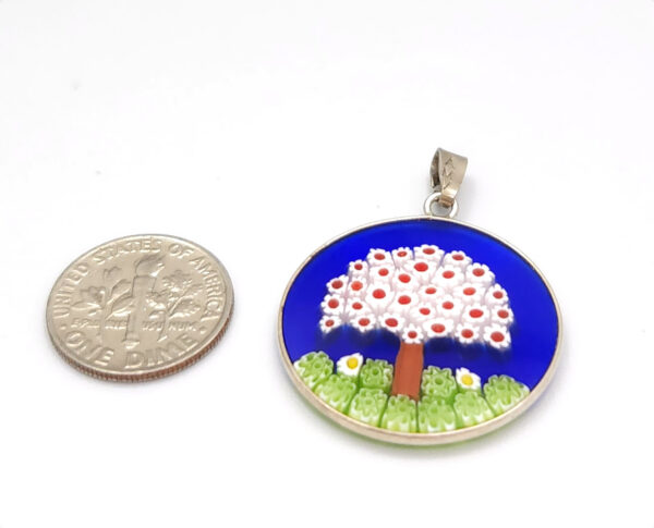 Millefiori tree pendant with dime for size comparison
