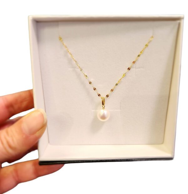 pearl and gold necklace in gift box