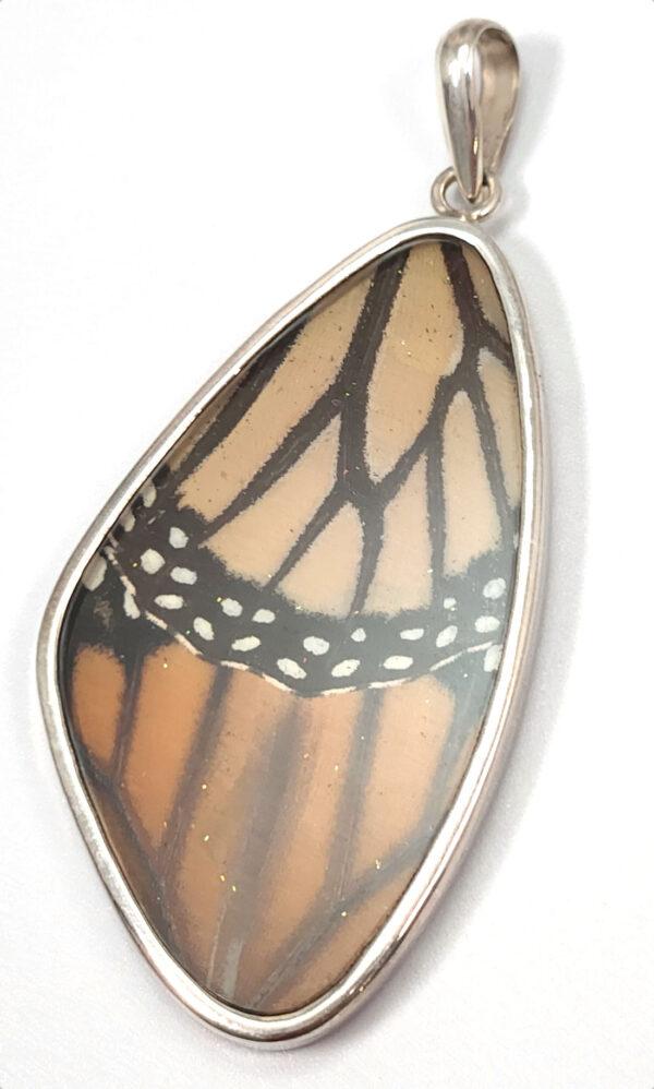 Real monarch butterfly wing under resin and sterling silver pendant
