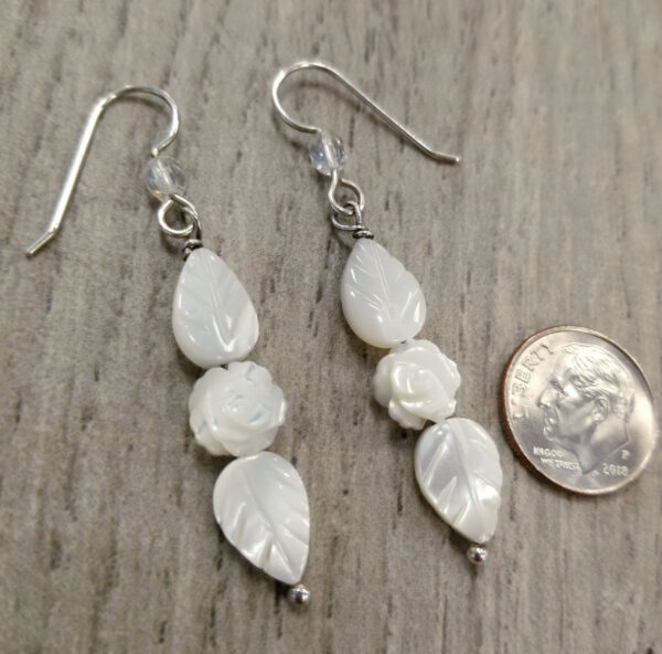 long mother of pearl rose earrings with dime for scale