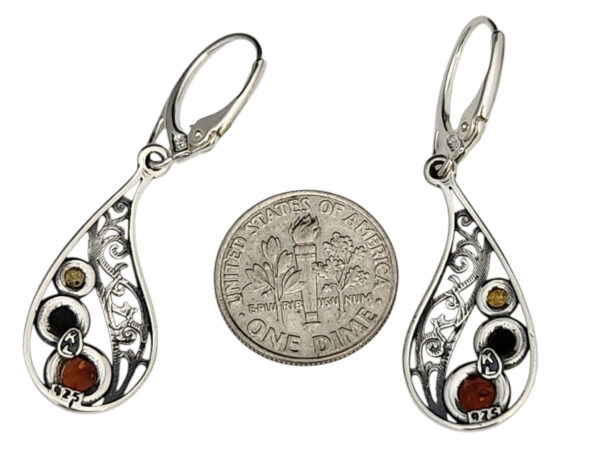 backside of amber earrings with dime for size comparison