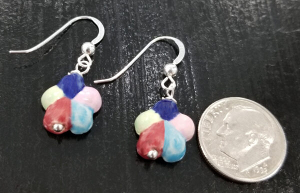 back of multi-color flower earrings with dime for scale
