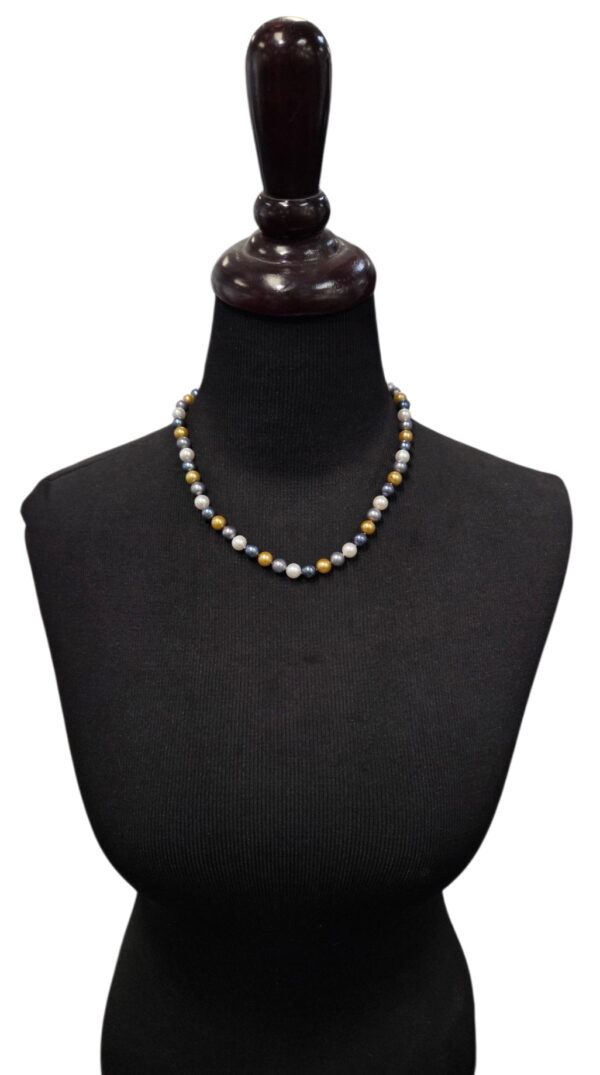 multicolor pearl necklace on dress form