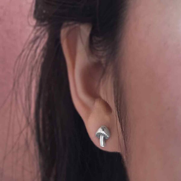 mushroom post earrings on model