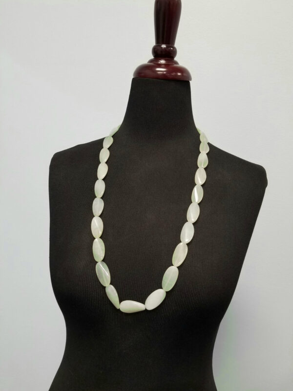 new jade long necklace on mannequin