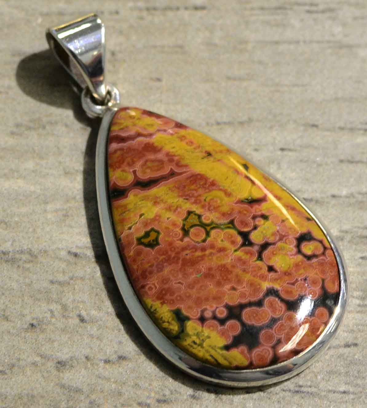 Orange and yellow ocean jasper and sterling silver pendant