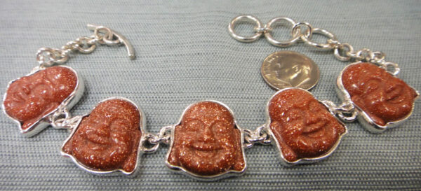 Orange goldstone laughing Buddha and sterling silver bracelet with dime for size
