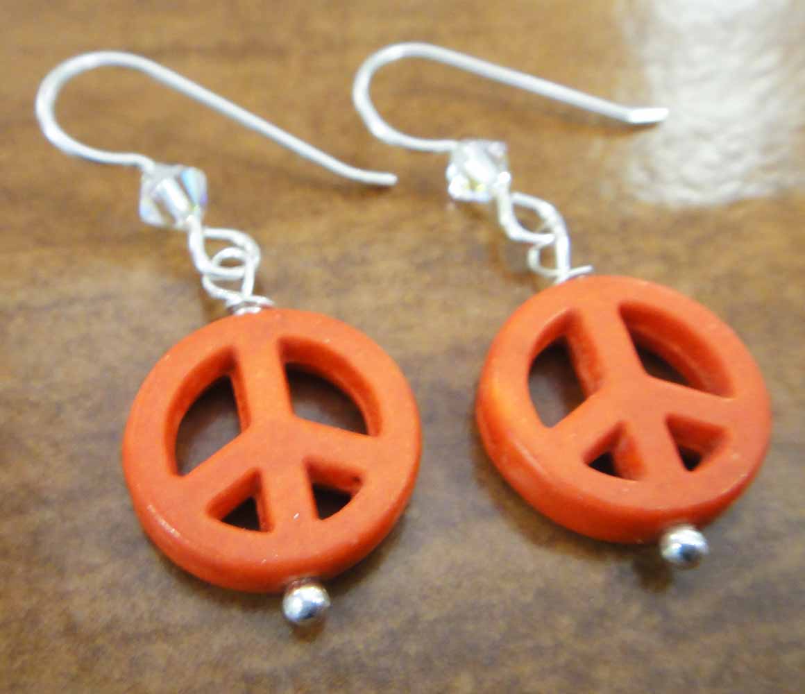 handmade orange peace signs, swarovski crystal beads, and sterling silver earrings