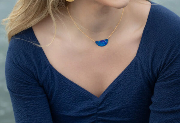 night sky inspired necklace on model